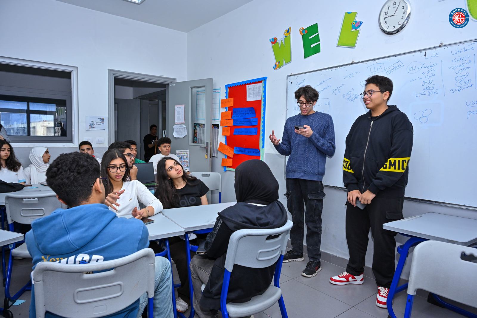 Two students presenting their startup to the class